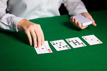 Image showing holdem dealer with playing cards