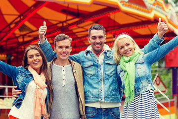 Image showing group of smiling friends showing thumbs up