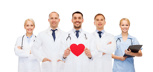 Image showing group of smiling doctors with red heart shape