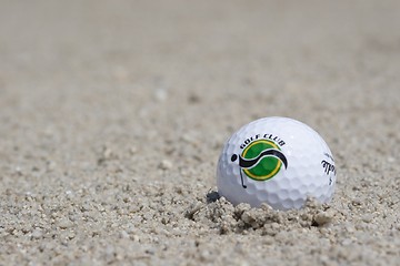 Image showing Golf ball in sand trap