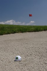 Image showing Golf ball in sand trap