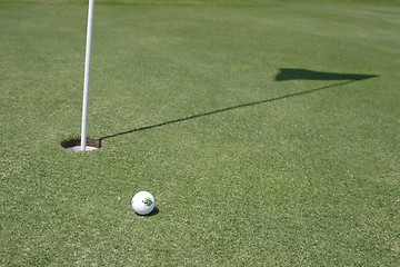 Image showing Golf ball on golf green