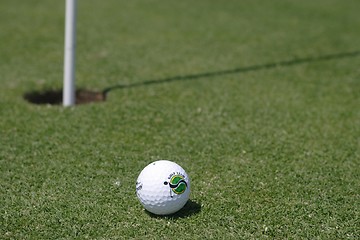Image showing Golf ball on golf green