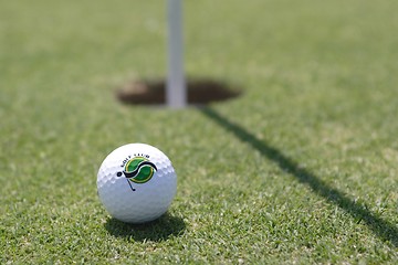 Image showing Golf ball on golf green