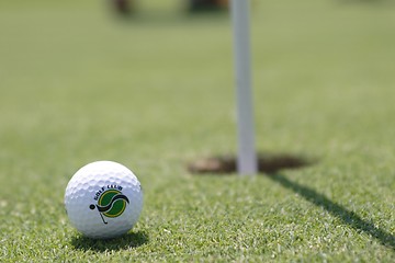 Image showing Golf ball on golf green