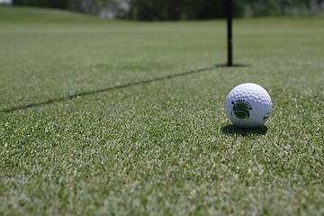 Image showing Golf ball on golf green