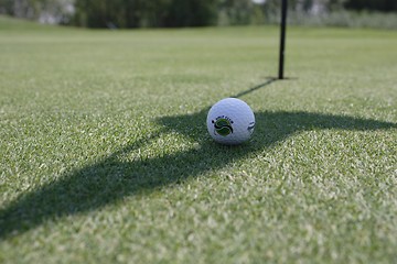 Image showing Golf ball on golf green