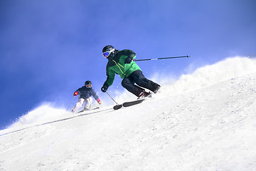 Image showing Two Skiers skiing