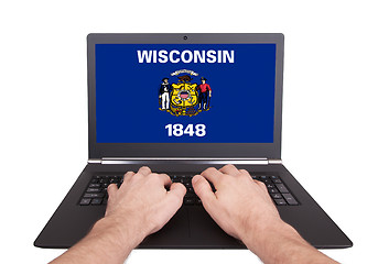 Image showing Hands working on laptop, Wisconsin