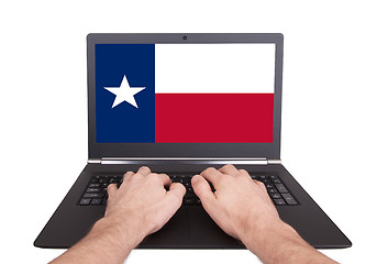 Image showing Hands working on laptop, Texas