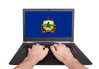 Image showing Hands working on laptop, Vermont