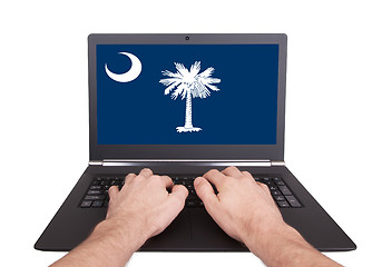 Image showing Hands working on laptop, South Carolina