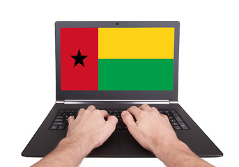 Image showing Hands working on laptop, Guinea-Bissau