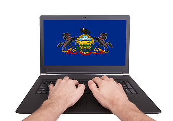 Image showing Hands working on laptop, Pennsylvania