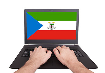 Image showing Hands working on laptop, Equatorial Guinea