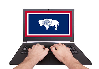 Image showing Hands working on laptop, Wyoming