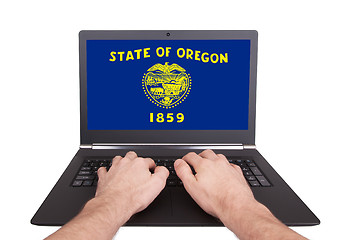 Image showing Hands working on laptop, Oregon