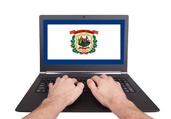 Image showing Hands working on laptop, West Virginia