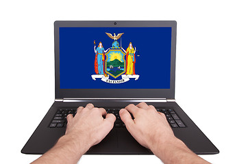 Image showing Hands working on laptop, New York