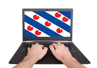 Image showing Hands working on laptop, Friesland