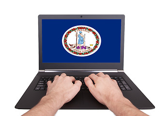 Image showing Hands working on laptop, Virginia