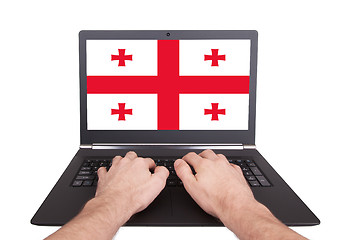 Image showing Hands working on laptop, Georgia