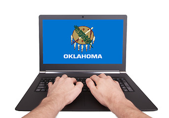 Image showing Hands working on laptop, Oklahoma