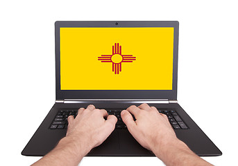 Image showing Hands working on laptop, New Mexico
