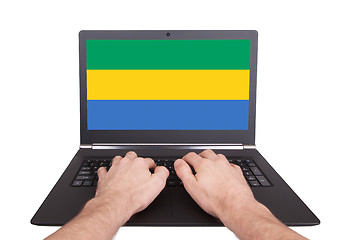 Image showing Hands working on laptop, Gabon