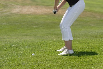 Image showing Female golfer playing