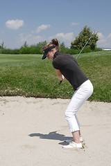 Image showing Female golfer playing