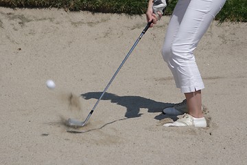 Image showing Female golfer playing