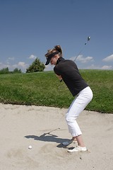 Image showing Female golfer playing