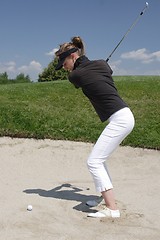 Image showing Female golfer playing