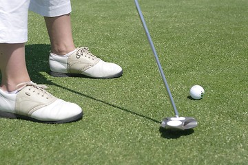 Image showing Female golfer playing