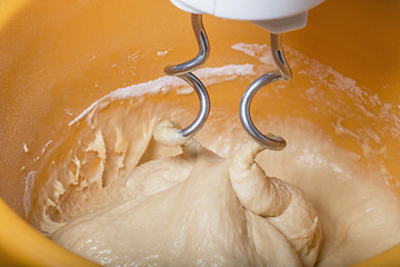 Image showing Kneading a dough with a machine 