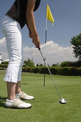 Image showing Female golfer playing