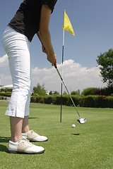 Image showing Female golfer playing