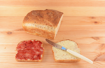 Image showing Fresh bread and two slices 
