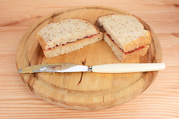 Image showing Two homemade PB&J sandwiches 