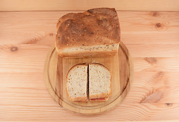 Image showing Fresh bread with two PB&J sandwiches