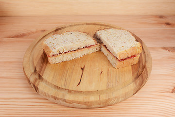 Image showing Freshly-made peanut butter and jam sandwiches