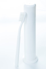 Image showing Toothpaste and toothbrush over white