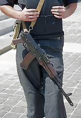 Image showing Ukrainian police officer with Kalashnikov automatic rifle.