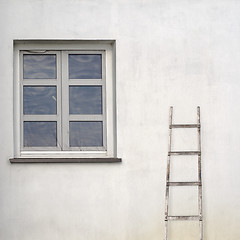 Image showing stucco wall with window and wooden ladder