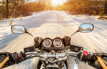 Image showing Biker First-person view. Winter slippery road