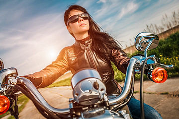 Image showing Biker girl on a motorcycle