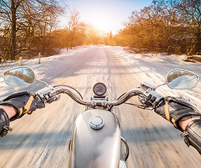 Image showing Biker First-person view. Winter slippery road