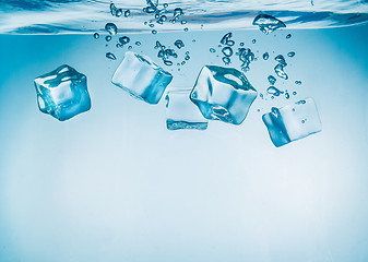 Image showing Ice cubes falling under water