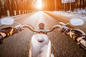 Image showing Biker First-person view. Winter slippery road